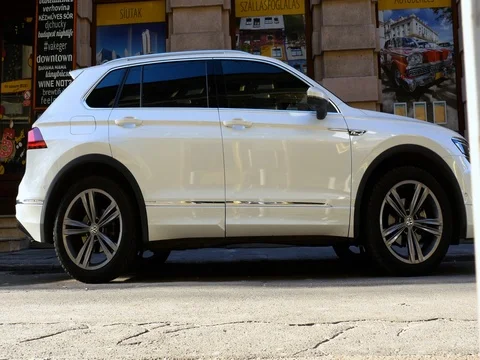 Side view of modern new white SUV car, panning effect. Video stock 79989988