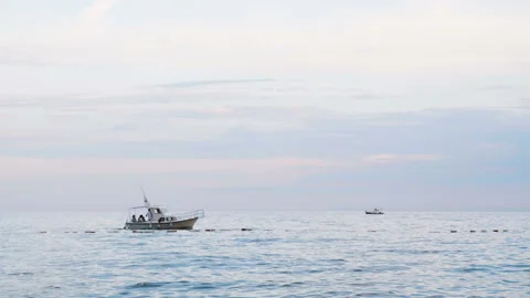 Side view of motor yacht under way out at sea. Montenegro Stock Footage 87460004
