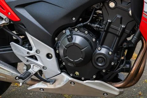 Side view of a motorcycle engine painted black. Stock Photos