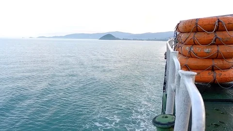 Side view of moving ferry boat with lifeboat on and beautiful blue sea water. Vídeos de archivo 89205467