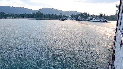 Side view of moving ferry boat and beautiful blue sea water surface and mountain Stock-Footage 89206529