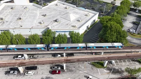 Side View of Moving Metrorail Train Kendall Miami Florida June 25th 2025 Stock Footage 311943348