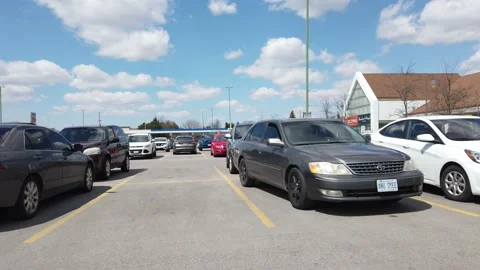 Side View Moving Past Vehicles in Parking Lot in Grocery Store Into Oncoming 動画素材 130912054