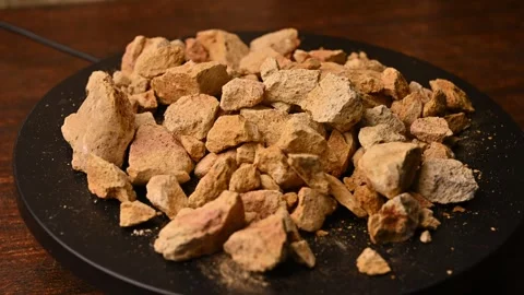 Side View of Multani Mitti (Fuller’s Earth) Rotating on Black Background Stock Footage 329342575