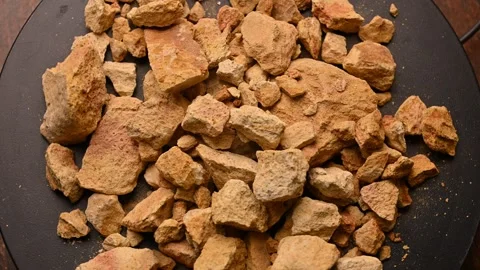 Side View of Multani Mitti (Fuller’s Earth) Rotating on Black Background Stock Footage 329343961