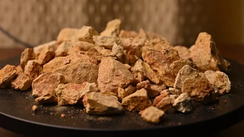 Side View of Multani Mitti (Fuller’s Earth) Rotating on Black Background Stock Footage 329355342