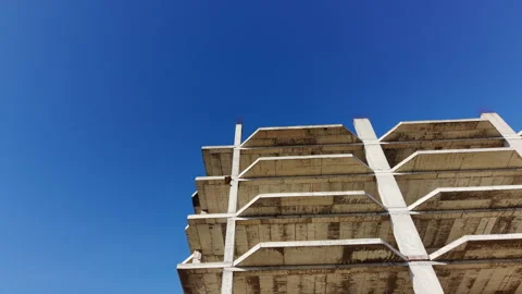 Side view of multi-story concrete building frame 스톡 동영상 327928017