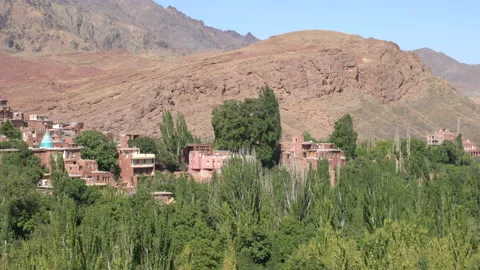 Side view of nature and red city Abyaneh, Iran, 4K, DNxHR 스톡 동영상 151039951