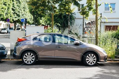 Side view of new Honda Hybrid car parked in the city Stock Photo #186871935