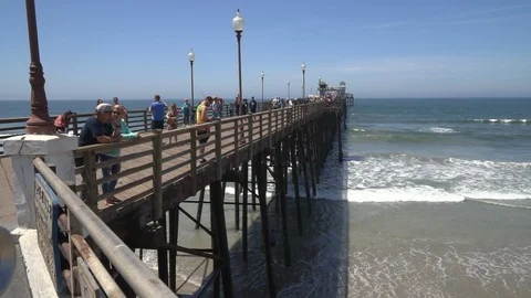 Side view of Oceanside Pier with people Stock Footage 97146870