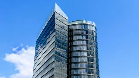 Side view of an office building in Vienna with cloudy sky in the background Stock Photos