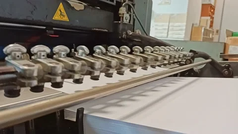 Side view of an offset printer in action Stock Footage 130979889