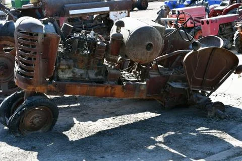 Side view of an old abandoned rusty agricultural tractor Stock Photos