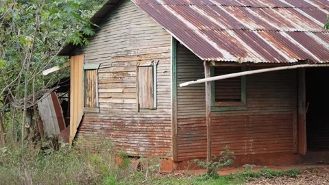 Side view. Old Abandoned Wooden House With rusted roof. Stock Footage 134166350