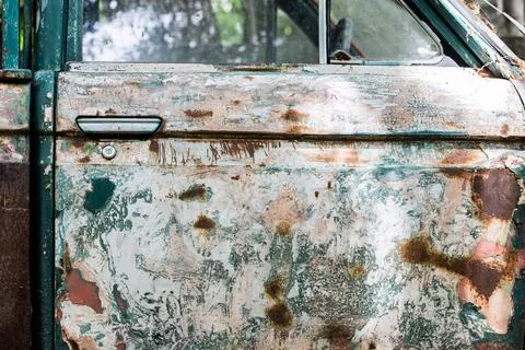 Side view of an old olive-green car. Stock Photos