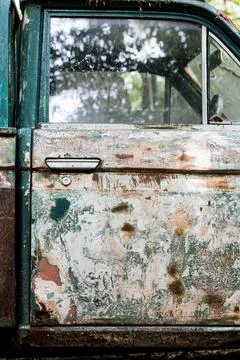 Side view of an old olive-green car. Stock Photos