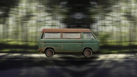 Side view of a Old Van driving on highway at high speed, forest background. Stock Footage 332314933
