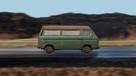 Side view of a Old Van driving on highway at high speed, mountain background. Stock Footage 332314972