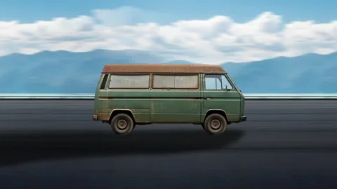 Side view of a Old Van driving on highway at high speed, blue sky and mountains. Video stock 332315052