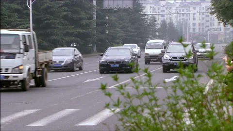 Side view of oncoming car Stock Footage 253771012