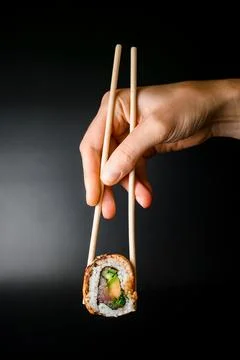 Side view of one piece of roll Philadelphia with salmon and cream cheese. Stock Photos