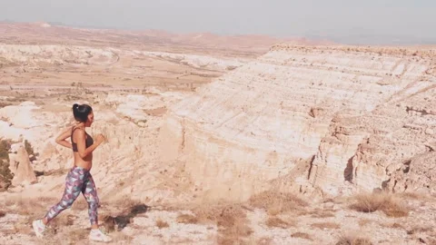 Side view outdoor workout - caucasian young female tired running on trail in  Stock-Footage 167678805