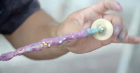 Side view of painting a mural on a wall with brush and roller and palette. Video stock 141754328