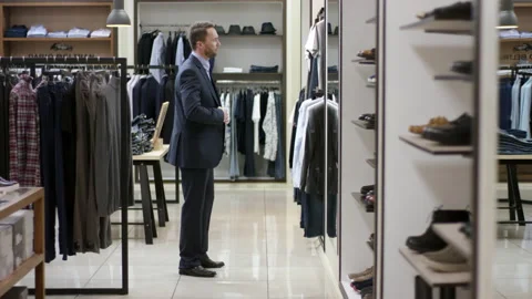 A side view panoramic video of a dark haired business man standing in front of Stock Footage 137969455