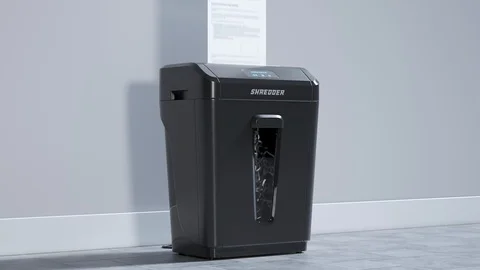 Side view at the paper shredder working. Documents shredding. Office. 4KHD Stock Footage 119987970