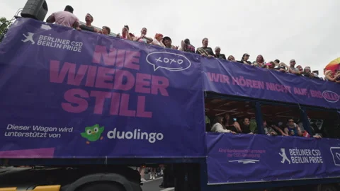 Side view of a parade truck featuring the Berliner CSD Berlin Pride logo, the Stock-Footage 346239250