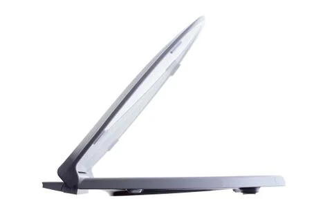 Side view of a partially opened white toilet seat Stock Photos