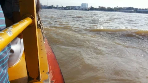 Side view on the passenger boat on Chao Phraya river with sunlight reflection Stock Footage 101369200