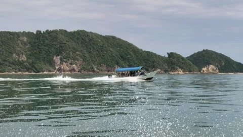 Side View of Passenger Speed Boat Cruising Fast on Ocean Wave Stock Footage 340222875