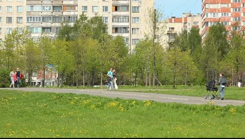 Side view on the path in the green zone of the city Stock Footage 5351316