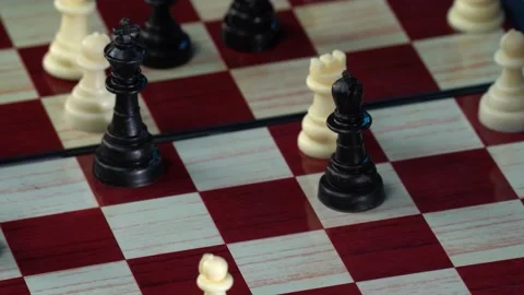 Side view of people hands moving chess figures playing chess isolated on black Stock Footage 155644185