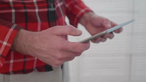 Side view of a person browsing information online on a smart tablet device. Stock Footage 337997922
