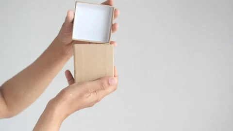 Side view of person open a empty small gift box 库存影片 247107658