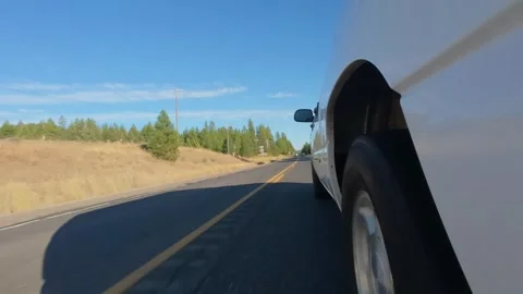 Side View of Pickup Truck Driving Along Rural Highway in Eastern Washington 4K Stock Footage 341504507