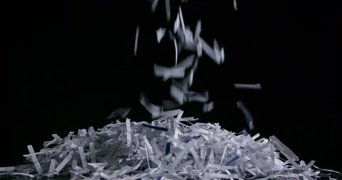 Side view of pile of shredded paper against black slow motion Stock Footage 123735240