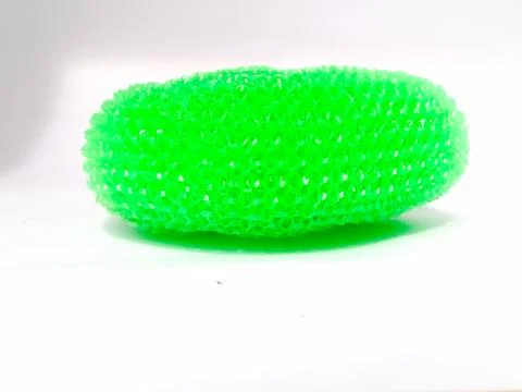 Side view of a plastic dish wash scrubber placed isolated in a white backgrou Stock Photos