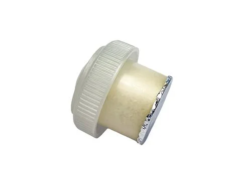 Side view of a plastic dispensing cap with a protective membrane Foto stock