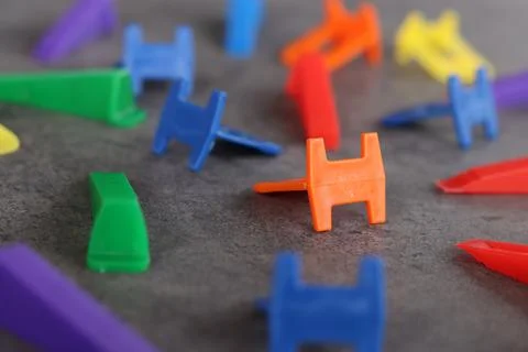 Side view of plastic wedges and clamps Stock Photos