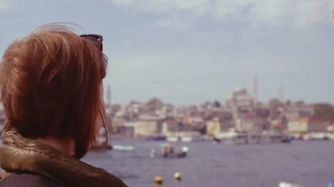 Side view portrait of beautiful young woman. Tourist woman in Istanbul against Stock Footage 58748343