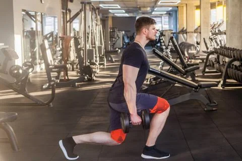 Side view portrait of concentration young adult sport man athlete working out Stock-Fotos
