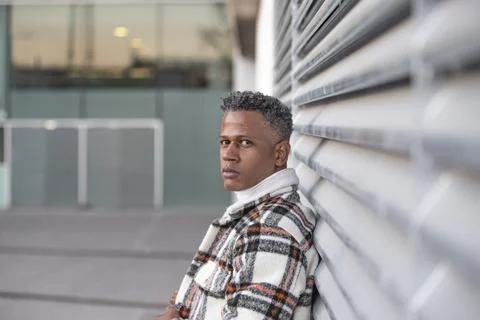 Side view portrait of a man with afro hairstyle looking at camera Stock Photos