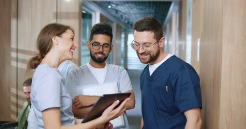 Side view portrait of multicultural group of young medical professionals Stock Footage 256215625