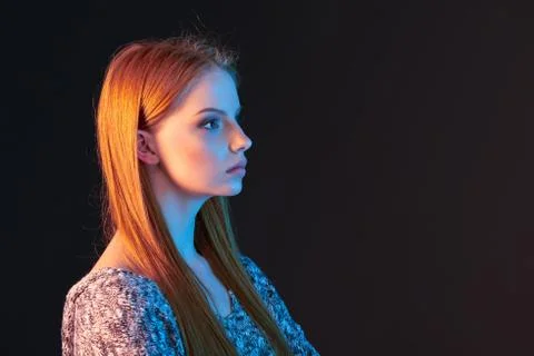 Side view portrait of red haired girl looking forward Stock Photos