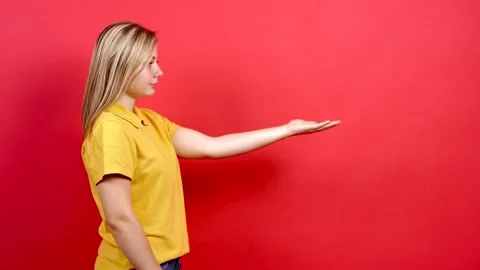 Side view, portrait of young and confident woman showing open palm. Stock Footage 140793435