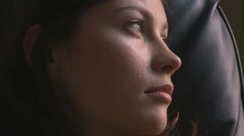 Side view portrait of young woman gazing Stock Footage