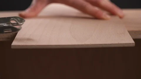 A side view of a power jigsaw cutting a piece of wooden board Stock Footage 103451417